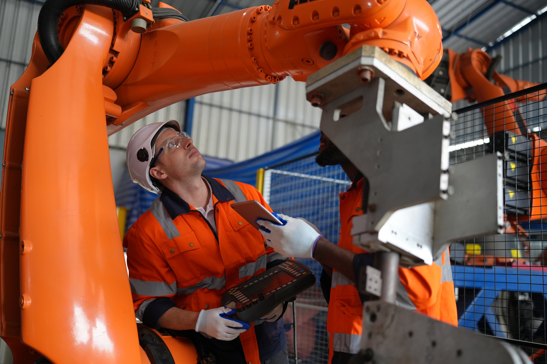 Business industry innovation technology, people with tech Innovation technological progress concept. Robotic Arm engineer check on equipment in its with software of an Artificial Intelligence Computer Processor Unit.
High Tech Robotic Arm with an Artificial Intelligence Computer Processor Unit in its.
