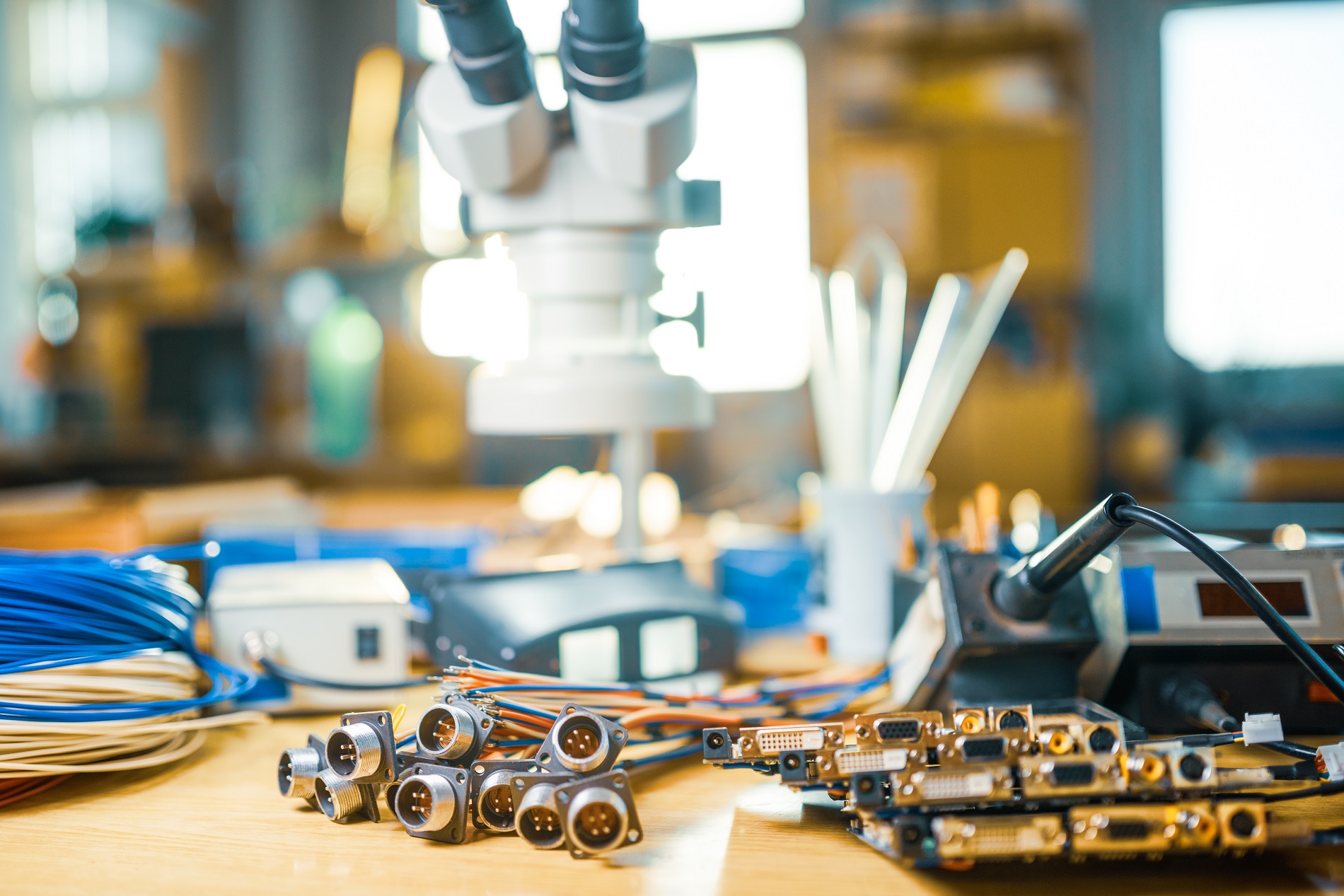 Modern microscope, electronic components in a scientific laboratory Large modern electron microscope and embedded microcircuits are stacked on test plate to prepare for the research of electronic components in a scientific laboratory