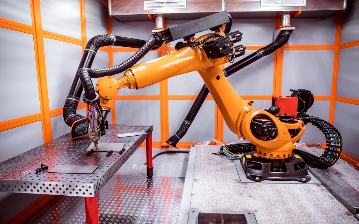 Fibre laser robotic remote cutting system. CNC Laser plasma cutting of metal, modern industrial technology.